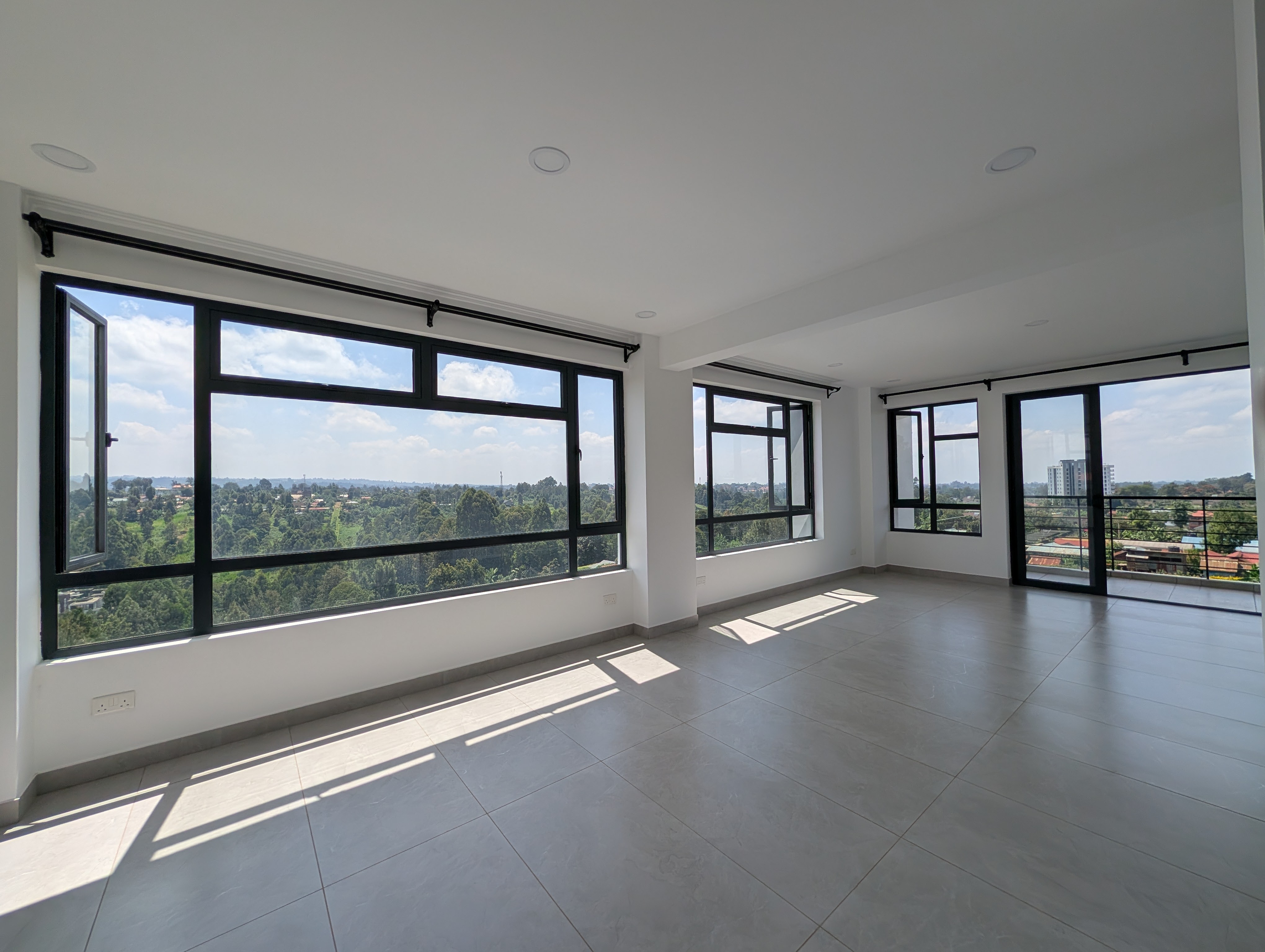 Spacious living area with panoramic windows and natural light