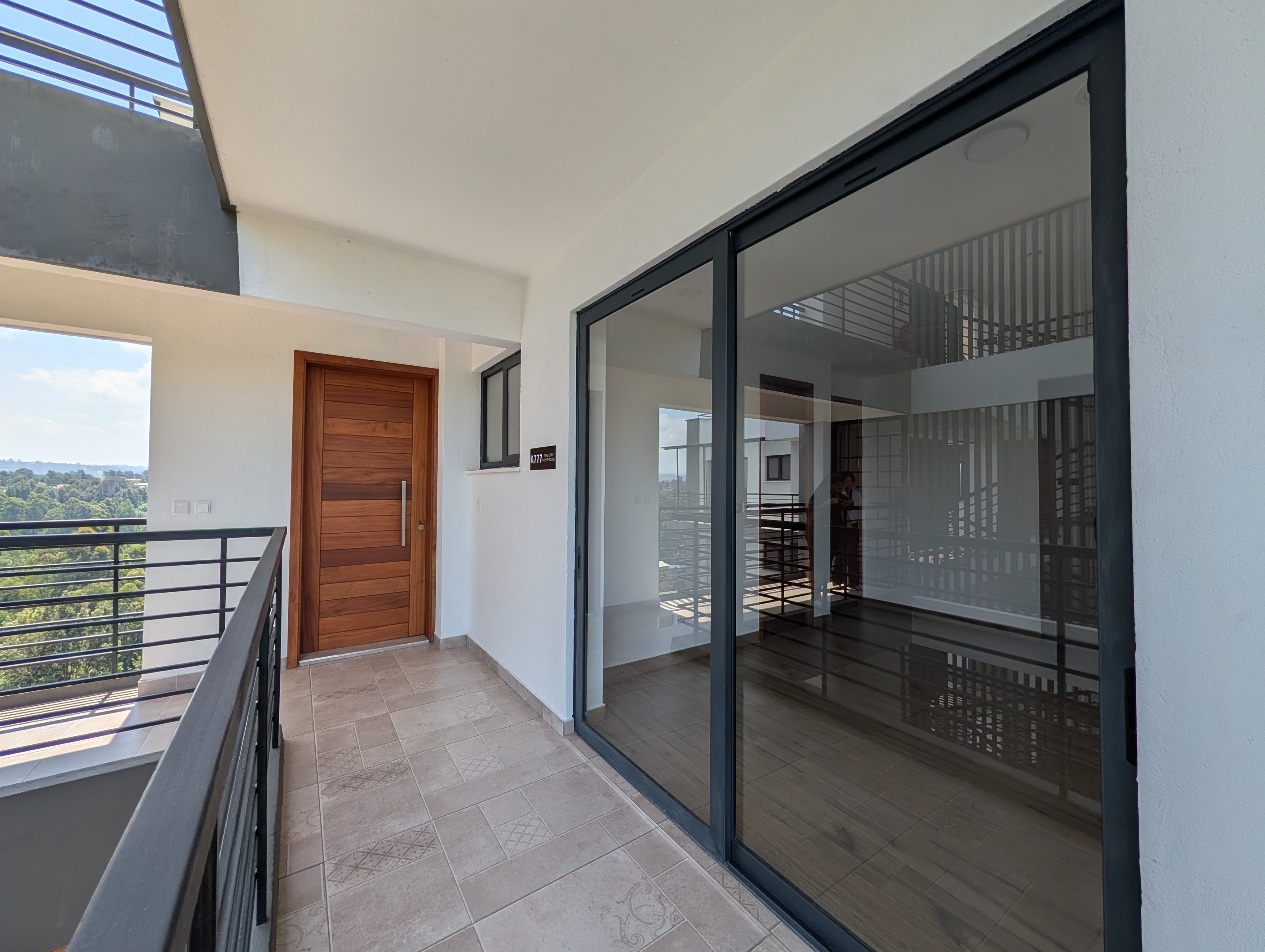 Third bedroom with floor-to-ceiling glass and balcony