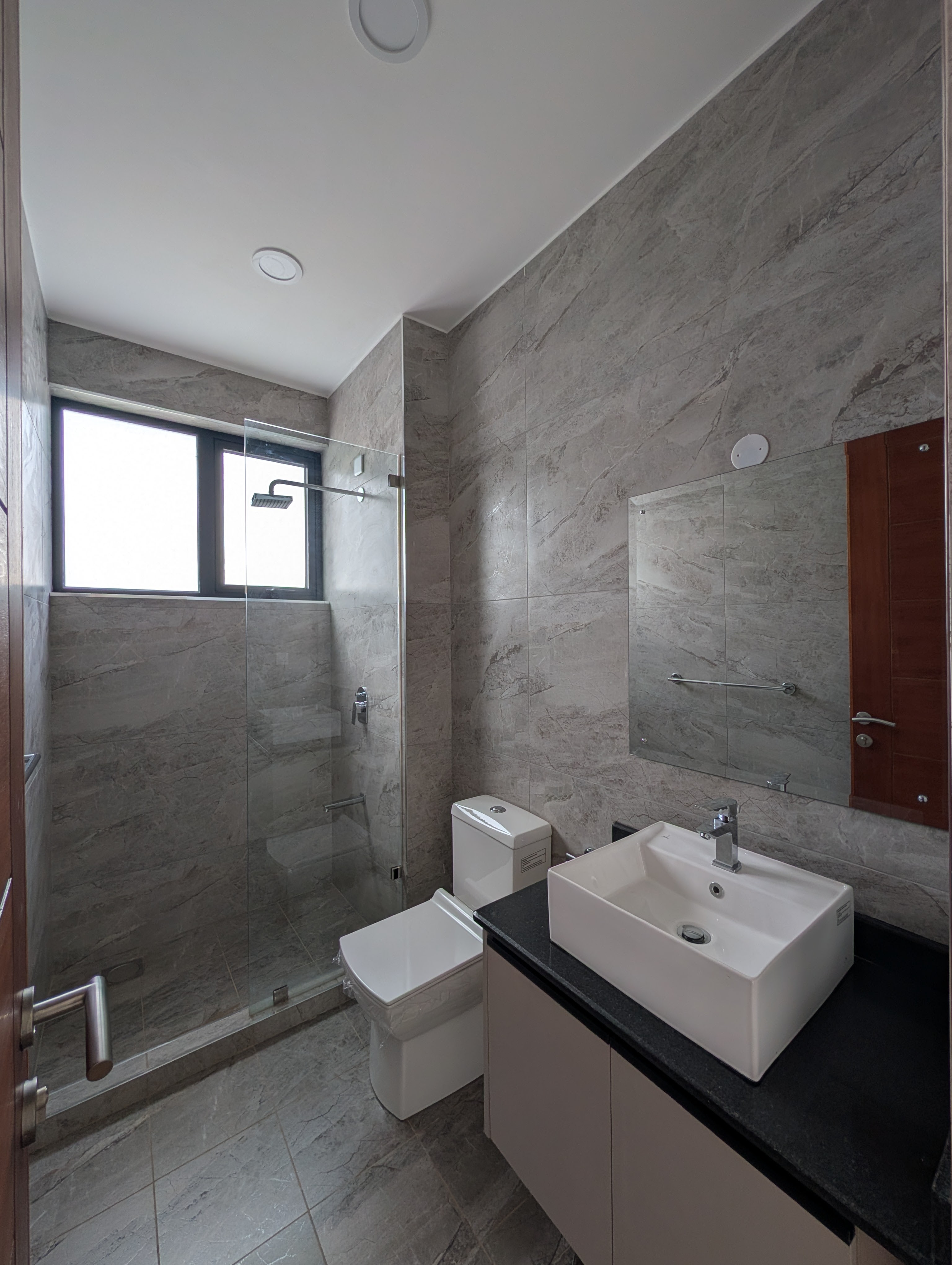 Marble bathroom with glass shower